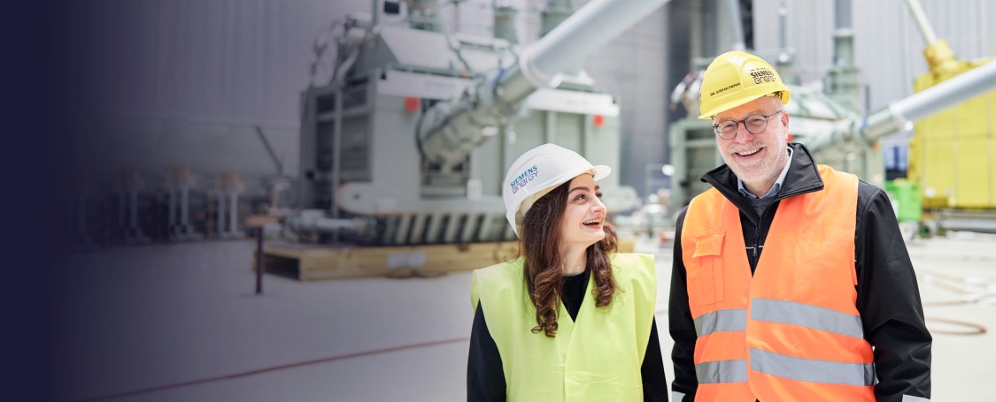 Christina Iosifidou, Head of Sustainability Grid Technologies at Siemens Energy and Dr. Stefan Pieper, Cluster Lead Large Power Transformers Europe at Siemens Energy discuss decarbonization at the Tranformer plant in Nürnberg.